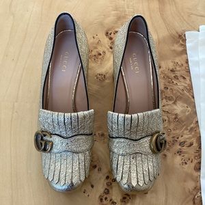 Gucci marmont platform heels in iridescent gold.